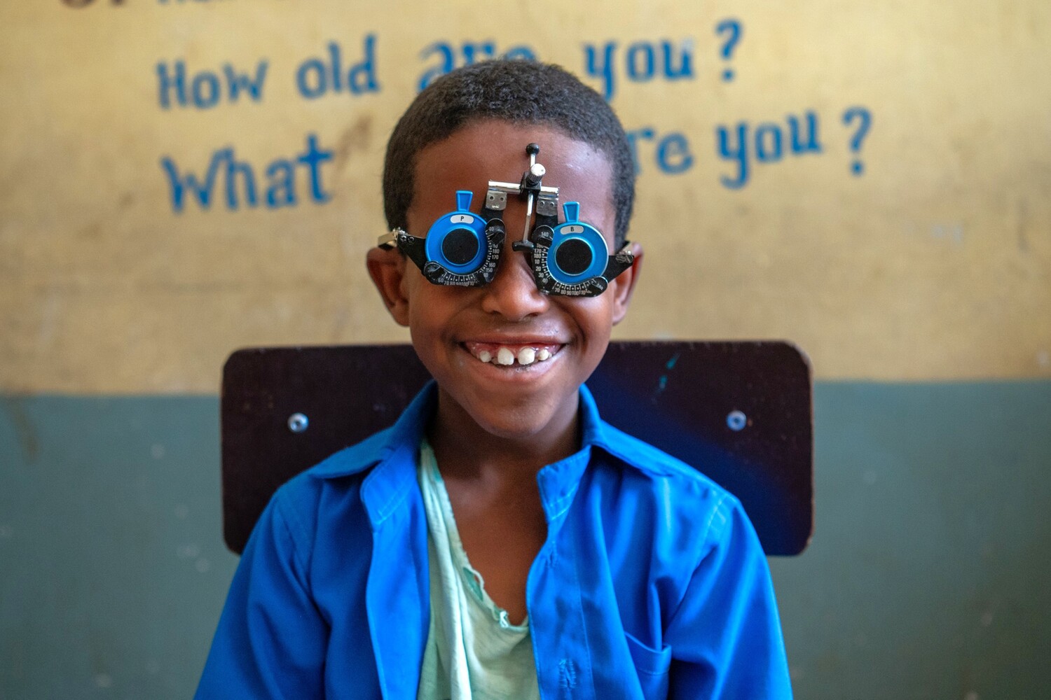 Kedir Mohamed, 9, is screened by Kibrom Legese, a 37-year-old optometrist and epidemiologist, during a school eye screening session in Aksum, Tigray, Ethiopia. Sponsored by Light for the World, the session aims to identify children with visual impair